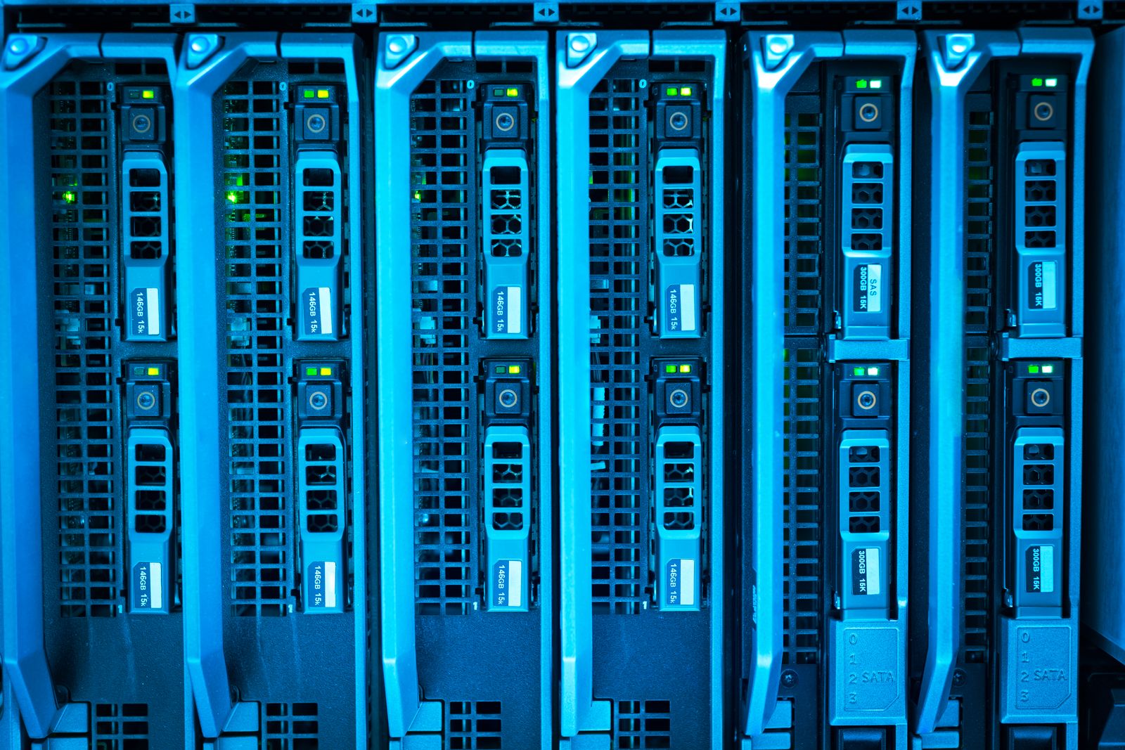 Rows of lit server racks in a data centre.
